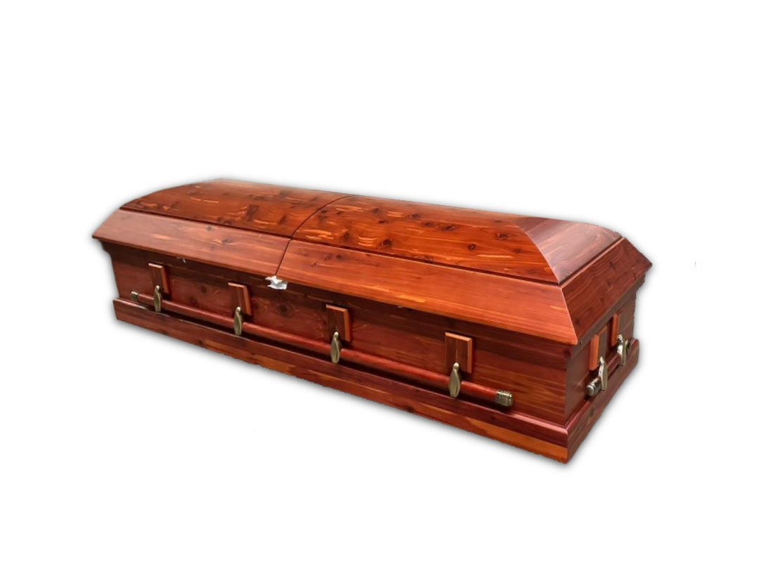 Sutton cedar veneer casket – Closed split-lid American-style casket with swing-bar handles and satin cedar-coloured finish.